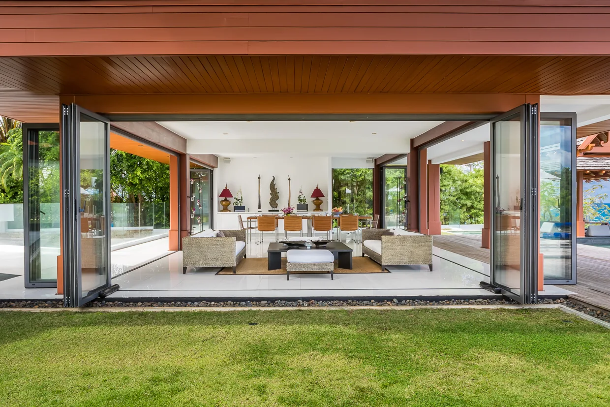 The living pavilion with its bifold walls open to the lawn