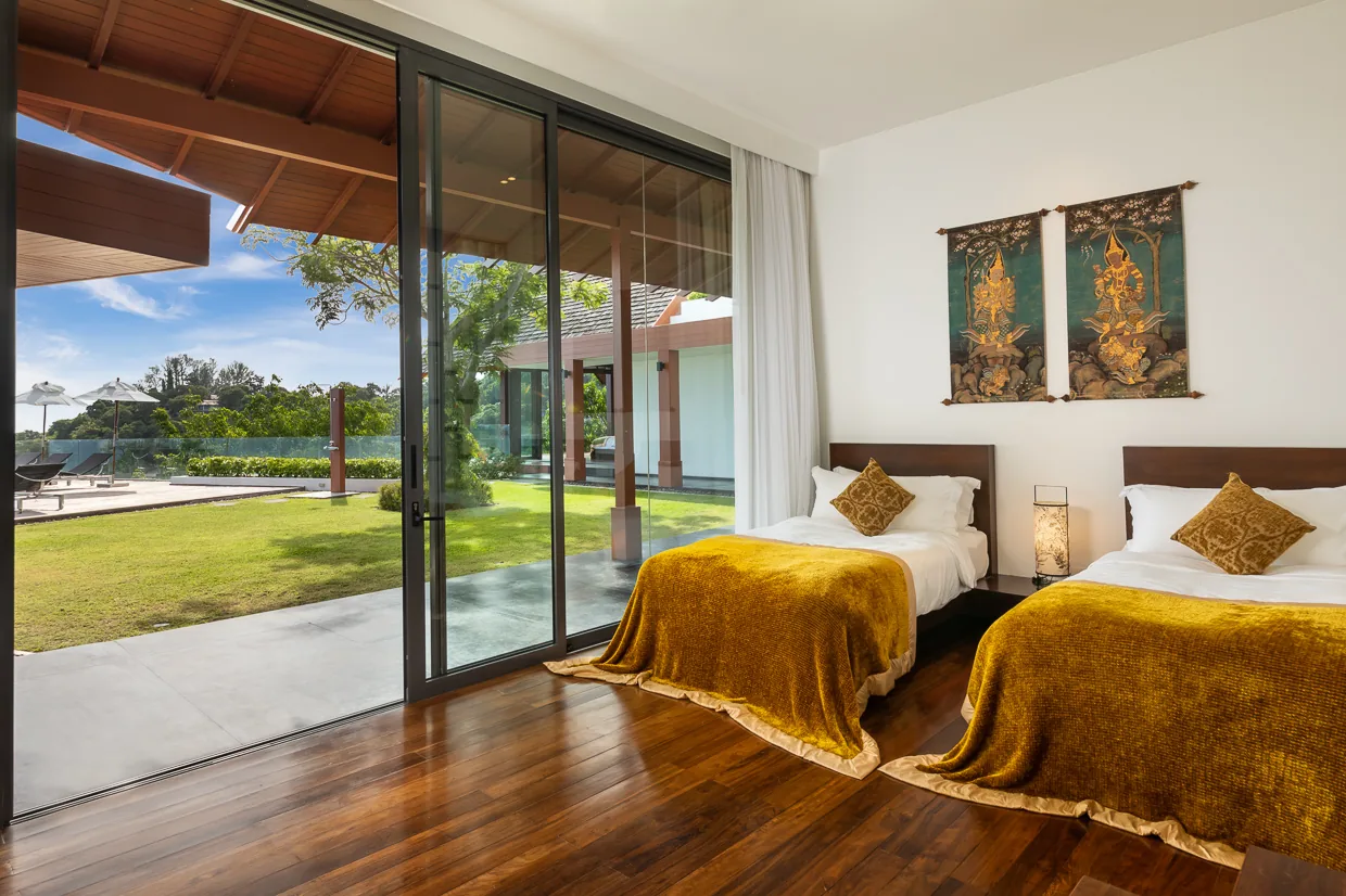 A twin bedroom opening straight onto the lawn